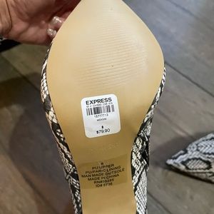 High heeled snake print ankle boots.